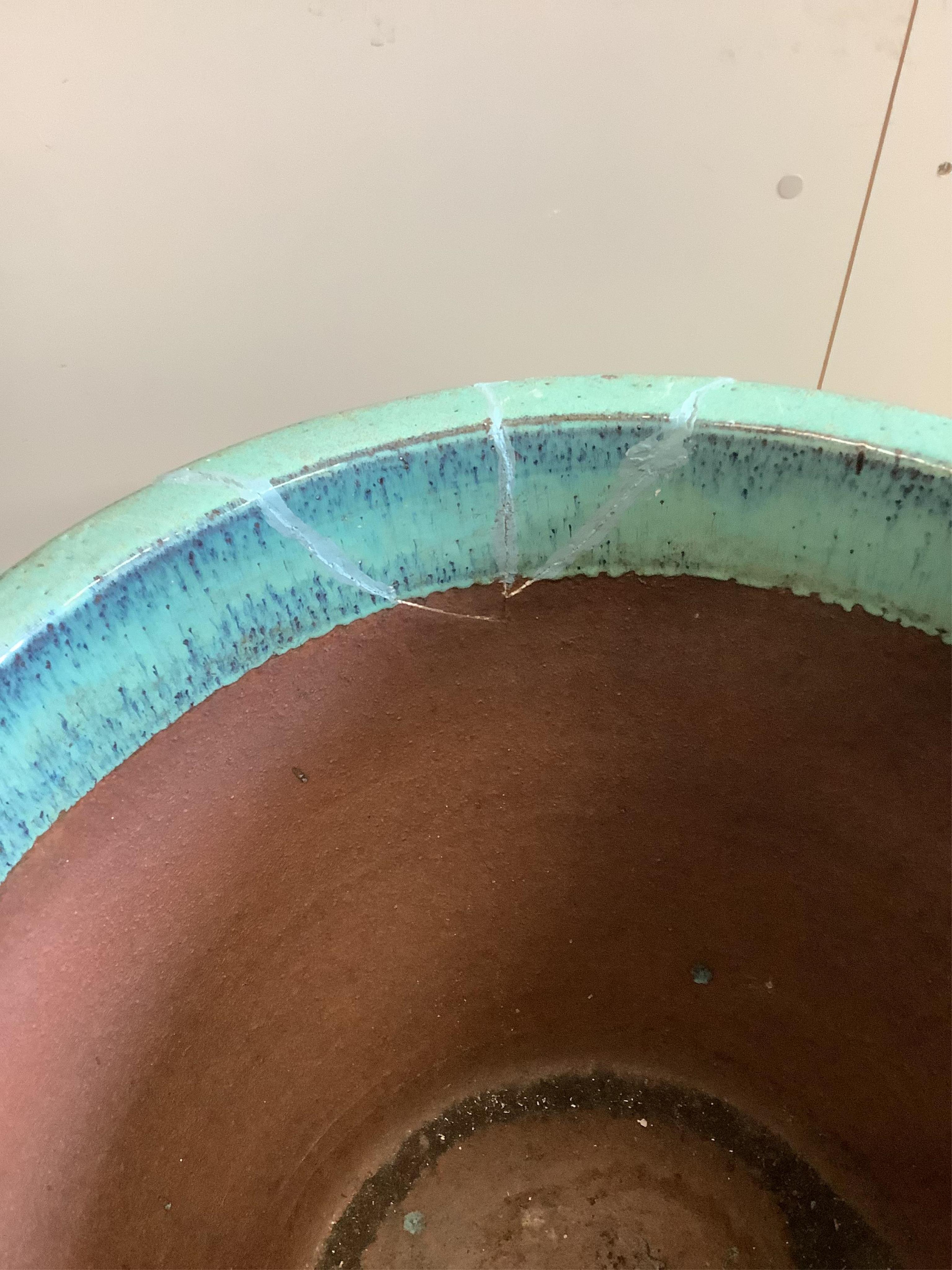 Two large turquoise glazed circular earthenware garden planters, larger diameter 64cm, height 49cm (one a.f.). Condition - fair to good